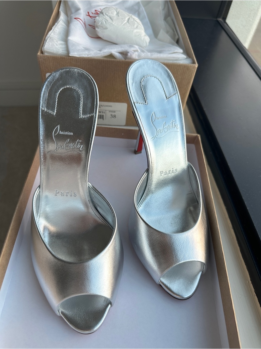 Christian Louboutin - Me Dolly  
Metallic Silver Open-Toe Slide Heels